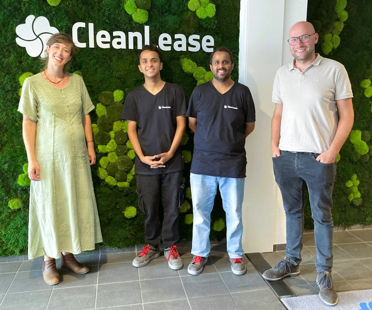 Teamfoto voor de Cleanlease-muurdecoratie.