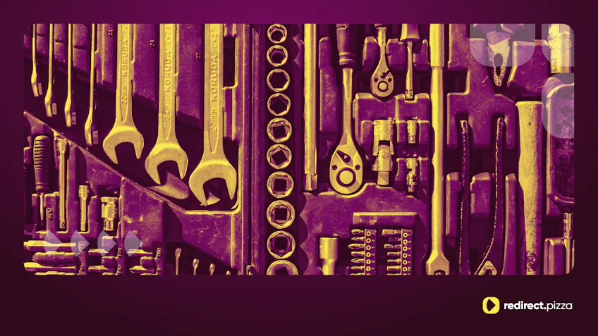 An open toolbox seen from above, with wrenches, sockets, screwdrivers, pliers and a hammer, each in its own slot